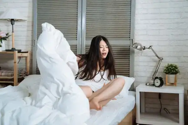 Image of woman getting up because of nighttime leaks Southend-on-Sea